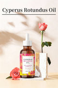 Bottle of Cyperus Rotundus Oil with flowers on a light background